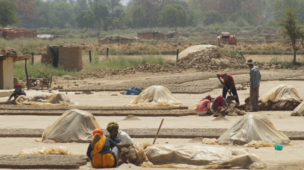 Workers making bricks on a kiln in Fatehpur, UP