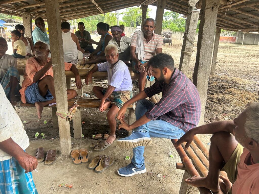 Guarav Gulmohar in conversation with local people at a tea shop in Bihar