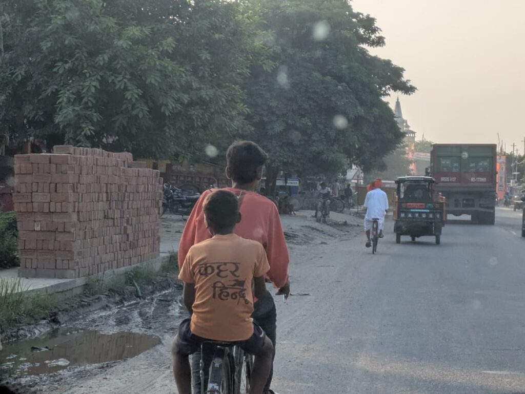 A boy wearing Tee-shirt bearing "Radical Hindutva" on it 