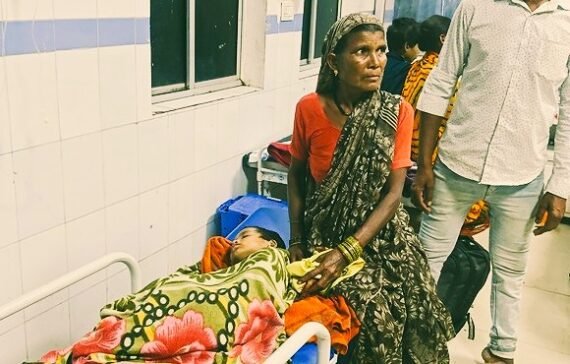 A Baiga tribal with her infant in the government hospital, Balaghat